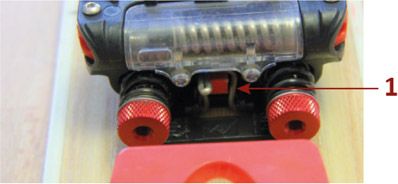 Lock the springbox onto the ski by raising up the touring hook